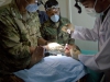 Capt. Abby Raymond, brigade dentist for the 4th Brigade Combat Team, 101st Airborne Division (Air Assault), checks on a patient after his tooth was extracted, during a basic dental class on at forward operating base Thunder, Afghanistan, July 22. (U.S. Army photo by Sgt. Justin A. Moeller, 4th Brigade Combat Team Public Affairs)