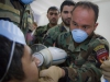 A soldier with the ANA\'s 2nd commando Kandak, 203rd Corps, utilizes a NOMAD portable x-ray as other commandos look on, during a basic dental class on at Forward Operating Base Thunder, Afghanistan, July 22. (U.S. Army photo by Sgt. Justin A. Moeller, 4th Brigade Combat Team Public Affairs)