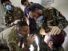 Capt. Abby Raymond, brigade dentist for the 4th Brigade Combat Team, 101st Airborne Division (Air Assault), checks the work of a medic with the ANA’s 2nd Commando Khandak, 203rd Corps, as he performs an oral exam on a fellow Commando, during a basic dental class on at forward operating base Thunder, Afghanistan, July 22. (U.S. Army photo by Sgt. Justin A. Moeller, 4th Brigade Combat Team Public Affairs)