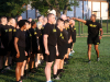 Master Sgt. Daarius Jackson, Office of the Staff Judge Advocate, Headquarters and Headquarters Battalion, 101st Airborne Division (Air Assault), divides a formation into 9 teams for circuit training behind Olive Gym on Fort Campbell, Kentucky, July 27. Jackson led the physical training and has been a Master Fitness Instructor in the Army for six years. (Pfc. Lynnwood Thomas, 40th Public Affairs Detachment)