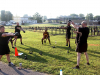 Soldiers from the Judge Advocate General Corps perform kettlebell swings during circuit training behind Olive Gym on Fort Campbell, Kentucky, July 27. The circuit training consisted of nine lanes and teams rotated through each during morning physical training. (US Army Photo by Pfc. Lynnwood Thomas, 40th Public Affairs Detachment)