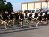 Soldiers participate in a short run between iterations of a circuit training session behind Olive Gym on Fort Campbell, Kentucky, July 27. The circuit training consisted of nine lanes and teams rotated through each during morning physical training. (US Army Photo by Pfc. Lynnwood Thomas, 40th Public Affairs Detachment)