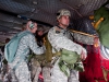 Sgt. 1st Class Bryan Beville, F Company, 5th Battalion, 101st Combat Aviation Brigade, 101st Airborne Division (Air Assault,) Pathfinders, airborne operations noncommissioned-officer-in-charge, does final checks to the jumpers\'s equipment on board a CH-47 Chinook helicopter from B Company, 6-101st CAB, Pachyderms, during a jump exercise at Fort Campbell, Ky., October 16, 2013. The jump was be the last airborne operation of the 101st Airborne Division.  (U.S. Army photo by Spc Joeseph Green, 159th CAB Public Affairs)