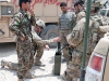 A U.S. Army Soldier with Security Forces Advisory and Assistance Team Blackhorse, 1st Battalion, 327th Infantry Regiment, 1st Brigade Combat Team, 101st Airborne Division, examines a container of mortar rounds at former Forward Operating Base Connolly, Nangarhar Province, Afghanistan, July 7, 2013.  (U.S. Army photo by Sgt. Margaret Taylor, 129th Mobile Public Affairs Detachment)