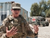 U.S. Army Sgt. Stacey Coffield, non-commissioned officer in charge, brigade Female Engagement Team, 1st Brigade Combat Team, 101st Airborne Division, of Orange County, Calif., describes how her body armor is supposed to fit at Forward Operating Base Fenty, Nangarhar Province, Afghanistan, on May 29, 2013. (U.S. Army photo by Sgt. Margaret Taylor, 129th Mobile Public Affairs Detachment)