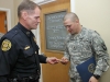 Chief Ansley presenting Demille with a CPD coin. (Photo by CPD-Jim Knoll)