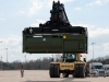 A crane moves a equipment returning from a deployment to Africa in the Campbell Rail Operations Facility March 24 at Fort Campbell, Ky. Units that deployed to Africa in support of Operation United Assistance had to bring more than 500 pieces of equipment back from Africa to undergo reset. (U.S. Army photo by Sgt. Leejay Lockhart, 101st Sustainment Brigade Public Affairs)