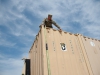 Spc. Adam Davis, a motor transport operator with the 74th Composite Transportation Company, 129th Combat Sustainment Support Battalion, 101st Sustainment Brigade, 101st Airborne Division, helps secure a container for transport March 24 at Fort Campbell, Ky. Soldiers from the 74th CTC played a vital role in the return of equipment from a deployment in Africa to prepare it for reset. (U.S. Army photo by Sgt. Leejay Lockhart, 101st Sustainment Brigade Public Affairs)