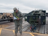 Staff Sgt. George McGraw, a unit movement officer from the 86th Combat Support Hospital, verifies equipment matches his manifest March 26 at Fort Campbell, Ky. As a UMO, McGraw made sure his junior enlisted understood their mission, which helped with property accountability and safety during railhead operations. (U.S. Army photo by Sgt. Leejay Lockhart, 101st Sustainment Brigade Public Affairs)