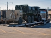 Tractor-trailers transport equipment back to an unloading area from a deployment in Africa March 30 at Fort Campbell, Ky. Units that deployed to Africa in support of Operation United Assistance had to bring more than 500 pieces of equipment back from Africa to undergo reset. (U.S. Army photo by Sgt. Leejay Lockhart, 101st Sustainment Brigade Public Affairs)