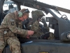 Spc. Marshall Miller, A Company, 1st Battalion, 101st Combat Aviation Brigade, AH-64 Apache helicopter crew chief, enters communication data into the systems of an AH-64 Apache helicopter during pre-flight checks at Forward Operating Base Salerno, Afghanistan, Jan. 16, 2013. (U.S. Army photo by Sgt. Duncan Brennan, 101st CAB public affairs)