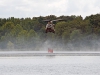 A CH-47 Chinook helicopter  with B Company, 6th Battalion, 101st Combat aviation Brigade, 101st Airborne Division (Air Assault) hovers while filling a bucket suspended from the helicopter during wildfire operations training at Lake Kyle recreation area at Fort Campbell, Ky., August 20, 2013.  (U.S. Army photo by Sgt. Duncan Brennan, 101st CAB Public Affairs)