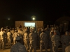 Soldiers with the 101st Sustainment Brigade, Task Force Lifeliner, Joint Forces Command – United Assistance, watch a slide show presentation of their accomplishments in Liberia during the celebration of the New Year at Camp Buchanan, Buchanan, Liberia, Dec. 31, 2014.  (U.S. Army photo by Sgt. 1st Class Mary Rose Mittlesteadt, 101st Sustainment Brigade Public Affairs/RELEASED)