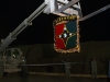 The 101st Sustainment Brigade, Task Force Lifeliner, Joint Forces Command – United Assistance, lower their patch in celebration of the New Year at Camp Buchanan, Buchanan, Liberia, Dec. 31, 2014.  (U.S. Army photo by Sgt. 1st Class Mary Rose Mittlesteadt, 101st Sustainment Brigade Public Affairs/RELEASED)