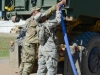 Sgt. Tony Clinton and Spc. Natalie Smith, both water purification specialist with the 129th Combat Sustainment Support Battalion, 101st Airborne Division Sustainment Brigade, 101st Airborne Division (Air Assault), hook a hose onto a Load Handling System Compatible Water Tank Rack, also called a hippo, to fill it with water that was purified through the tactical water purification system Sept. 3, 2015, at the Joint Readiness Training Center’s Intermediate Staging Base in Alexandria, Louisiana. (Sgt. 1st Class Mary Rose Mittlesteadt, 101st Airborne Division Sustainment Brigade (Lifeliners) Public Affairs)
