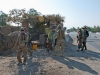 U.S. Army Soldiers from Security Forces Advisory and Assistance Team Archangel, 1st Brigade Combat Team, 101st Airborne Division, and Afghan National Army soldiers approach a security checkpoint on Highway 7 in Bati Kot district, Nangarhar Province, Afghanistan, June 15, 2013. (U.S. Army photo by Sgt. Margaret Taylor, 129th Mobile Public Affairs Detachment)