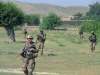 Soldiers with Easy Company, 2nd Battalion, 506th Infantry Regiment, 4th Brigade Combat Team, 101st Airborne Division, make their way across a field during a mission in Khowst Province, Afghanistan, on June 2, 2013. (Photo by Sgt. Justin A. Moeller, 4th Brigade Combat Team Public Affairs)