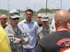 Army Col. R.J. Lillibridge, Commander of the 3rd Brigade Combat Team \"Rakkasans,\" 101st Airborne Division (Air Assault), speaks with riders during the motorcycle mentorship day event at Fort Campbell, Ky., June 12, 2013. Lillibridge tells the Rakkasan riders of the commands full support to motorcyclists as well as discusses the safety standards within the brigade. (Photo by Army Spc. Brian Smith-Dutton 3/101 Public Affairs)