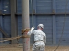 A demonstration of different repelling techniques at the Air Assault Tower.