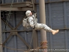 A demonstration of different repelling techniques at the Air Assault Tower.