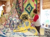 Brittany arranges quilts by color and subject