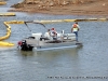 TMS Contracting moving the turbidity barrier from the mouth of the Marina Basin using a Crestliner pontoon boat on loan from Bill Roberts Thunder Road Marina.