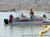 TMS Contracting moving the turbidity barrier from the mouth of the Marina Basin using a Crestliner pontoon boat on loan from Bill Roberts Thunder Road Marina.