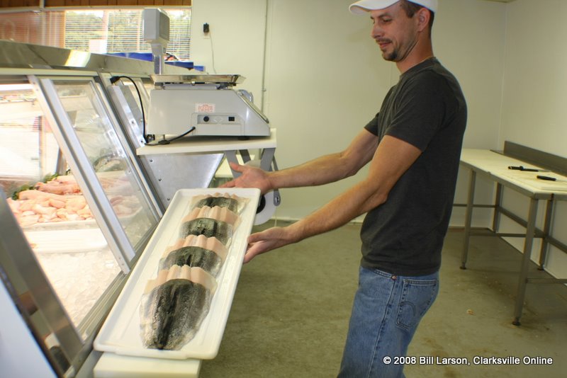 Chris shows off a tray of fresh fish