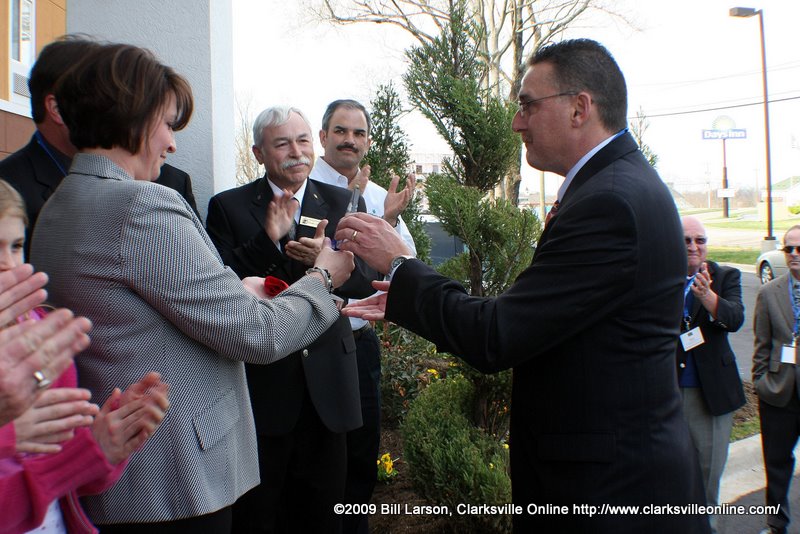 Kevin Lewis, Extended Stays Brands of Choice Hotels presents KimVan Stavern with 100th facility award Kevin J. Lewis presents Kim VanStavern commemorative award celebrating the opening of 100th Extended Stay Choice Hotel
