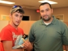 (L to R) Douglas Jackson and Detective Kagan Dindar with Gizzy. (Photo by CPD – Jim Knoll)