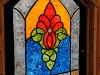 A stained glass window that was hand-painted by a team of chaplain’s assistants is now on display at the chapel on Forward Operating Base Salerno, Afghanistan. A team of chaplain’s assistants teamed up together to finish the restoration of their chapel after it badly damaged by an attack on the FOB in the summer of 2012. (U.S. Army photo by Sgt. 1st Class Abram Pinnington, TF 3/101 Public Affairs)