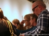 John McDonald and Susan Bryant stand among the crowd enjoying their first look at the donated art