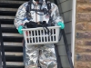 An agent with the 19th JDDTF carries evidence out of a meth lab in an apartment on South Hampton Street.