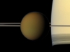 Titan Upfront - The colorful globe of Saturn\'s largest moon, Titan, passes in front of the planet and its rings in this true color snapshot from NASA\'s Cassini spacecraft. (Image credit: NASA/JPL-Caltech/SSI)