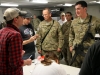 Sgt. Isaiah Myers, a soldier assigned to Troop B, 1st Squadron, 33rd Cavalry Regiment, 3rd Brigade Combat Team \"Rakkasans,\" 101st Airborne Division (Air Assault), speaks with songwriter Thomas Verges during an autograph session by the Nashville to You Tour at Camp Clark, Nov. 15, 2012. Myers and Verges discussed how they born and raised not far from each other in Louisiana. The tour featured Nashville\'s top songwriters and performers as they traveled throughout Afghanistan performing for deployed soldiers. (U.S. Army Photo by Sgt. 1st Class Abram Pinnington, TF 3/101 PAO)