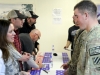 Grammy award-winning songwriter Hillary Lindsey speaks with a soldier during an autograph session during a visit by the Nashville to You Tour at Forward Operating Base Gardez, Nov. 15, 2012. The tour featured Nashville\'s top songwriters and performers as they traveled throughout Afghanistan performing for deployed soldiers. (U.S. Army Photo by Sgt. 1st Class Abram Pinnington, TF 3/101 PAO)