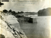 This is Lock and Dam 1 looking upstream from the right bank on the Cumberland River in Nashville, Tenn., June 16, 1913. The U.S. Army Corps of Engineers Nashville District built the lock and dam to establish a navigation channel. The old locks and dams were later replaced by today's modern dams. (USACE Photo)