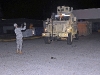 Second Battalion, 327th Infantry Regiment, 1st Brigade Combat Team, 101st Airborne Division, assists in backing up a Mine-Resistant Ambush Protected vehicle Nov. 17th, outside their battalion here. (Photo by Sgt. Richard Daniels Jr.)