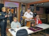 Post Commander Larry Helser reading the award citation to Officer Caver. (Photo by CPD-Jim Knoll)