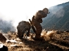 U.S. Army Sgt. Richard A. Darvial (kneeling), a combat medic from Amery, WI, takes cover while U.S. Army Spc. Corey C. Canterbury, a mortar man from Ocean Springs, MS, fires mortars from a mountain top overlooking the Ganjgal Valley in eastern Afghanistan’s Kunar Province Dec. 11th. (Photo by U.S. Army Staff Sgt. Mark Burrell, Task Force Bastogne Public Affairs)