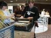 Graphic Arts student aids conference attendee in making his own poster on the Goldsmith Press