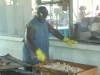 David Carney over a tray of barbecue pork