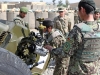 A soldier with the Afghanistan National Army\'s 4th Kandak, 1st Infantry Brigade, 203rd Afghan Army Corps, adjusts the sights on his Russian made D-30 122mm howitzer as U.S. Army Master Sgt. Liviu Ivan, who hails from Gaithersburg, Md., and a D-30 howitzer subject matter expert with 3rd Battalion, 320th Field Artillery Regiment, 3rd Brigade Combat Team “Rakkasans,