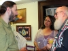 Exposition attendees discuss displayed entries