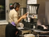 Arleen Reed gets some drinks ready for an order at the drive-thru