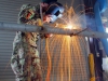 PAKTYA PROVINCE, Afghanistan â?? Spc. Toor Jan of the 203rd Afghan National Army Engineer Khandak welds a piece of rebar to a pole that will be used for a wind-sock for the flight line on forward operating base Thunder, Afghanistan, July 2, 2013. (U.S. Army photo by Sgt. Justin A. Moeller, 4th Brigade Combat Team Public Affairs)