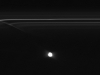 Images from NASA\'s Cassini spacecraft: Images from NASA\'s Cassini spacecraft have revealed half-mile-sized (kilometer-sized) objects punching through parts of Saturn\'s F ring, leaving glittering trails behind them. These trails in the rings, which scientists are calling \"mini-jets,\" fill in a missing link in our story of the curious behavior of the F ring. 
