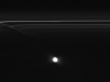 Images from NASA\'s Cassini spacecraft: Images from NASA\'s Cassini spacecraft have revealed half-mile-sized (kilometer-sized) objects punching through parts of Saturn\'s F ring, leaving glittering trails behind them. These trails in the rings, which scientists are calling \"mini-jets,\" fill in a missing link in our story of the curious behavior of the F ring. 