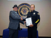 Sergeant Terry Minton is congratulated by Clarksville Police Chief Al Ansley during his retirement ceremony. (Jim Knoll, CPD)