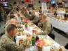 Soldiers assigned to Camp Clark, Afghanistan enjoy a large Christmas lunch on Christmas Day. The dining facility maximized every effort to ensure the Soldiers experienced the best dining expeience possible while deployed away from their familes during the holiday season. (U.S. Army photo by Sgt. 1st Class Abram Pinnington, TF 3/101 Public Affairs) 